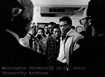 An image of Black students confronting administration about racism on campus. 