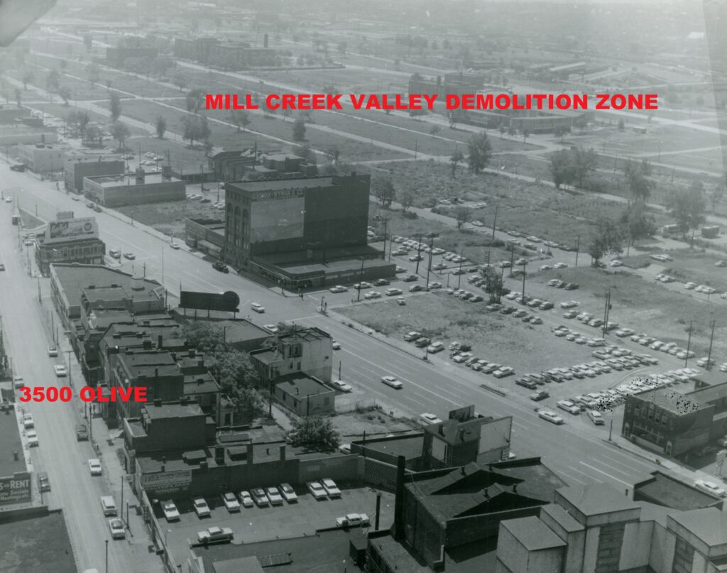 An aerial view of the 3500 block of Olive and its environs in the early 1960s, taken from the Continental Life Building looking toward the southeast. The mostly empty, grass-covered lots in the upper-right portion of the photograph were part of the Mill Creek Valley slum clearance area. Image courtesy of the Missouri History Museum. 