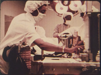 A still from the film "Code Blue" depicting doctors in a surgical theater operating room. 