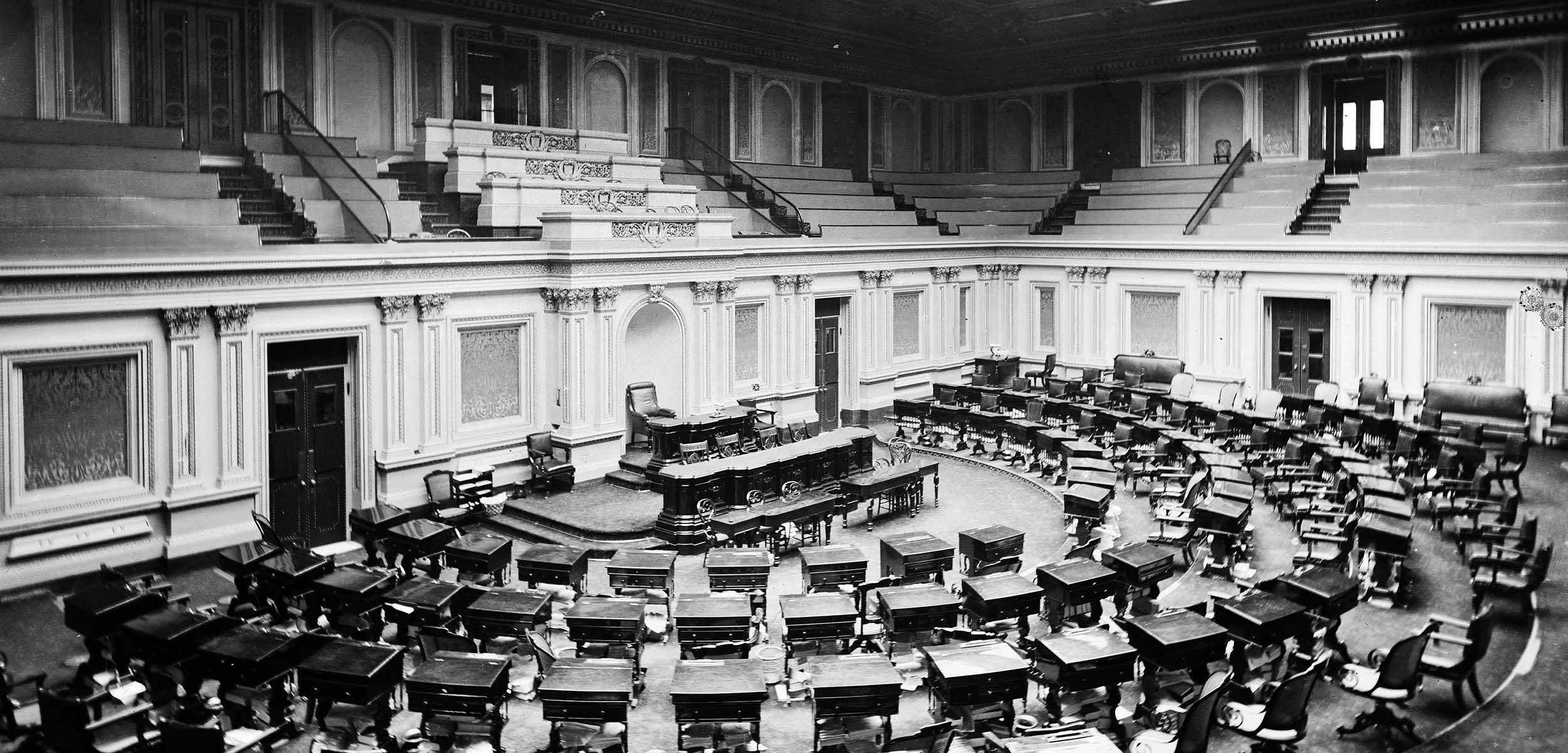 Black and white photo of the empty US Senate Chamber, circa 1873.