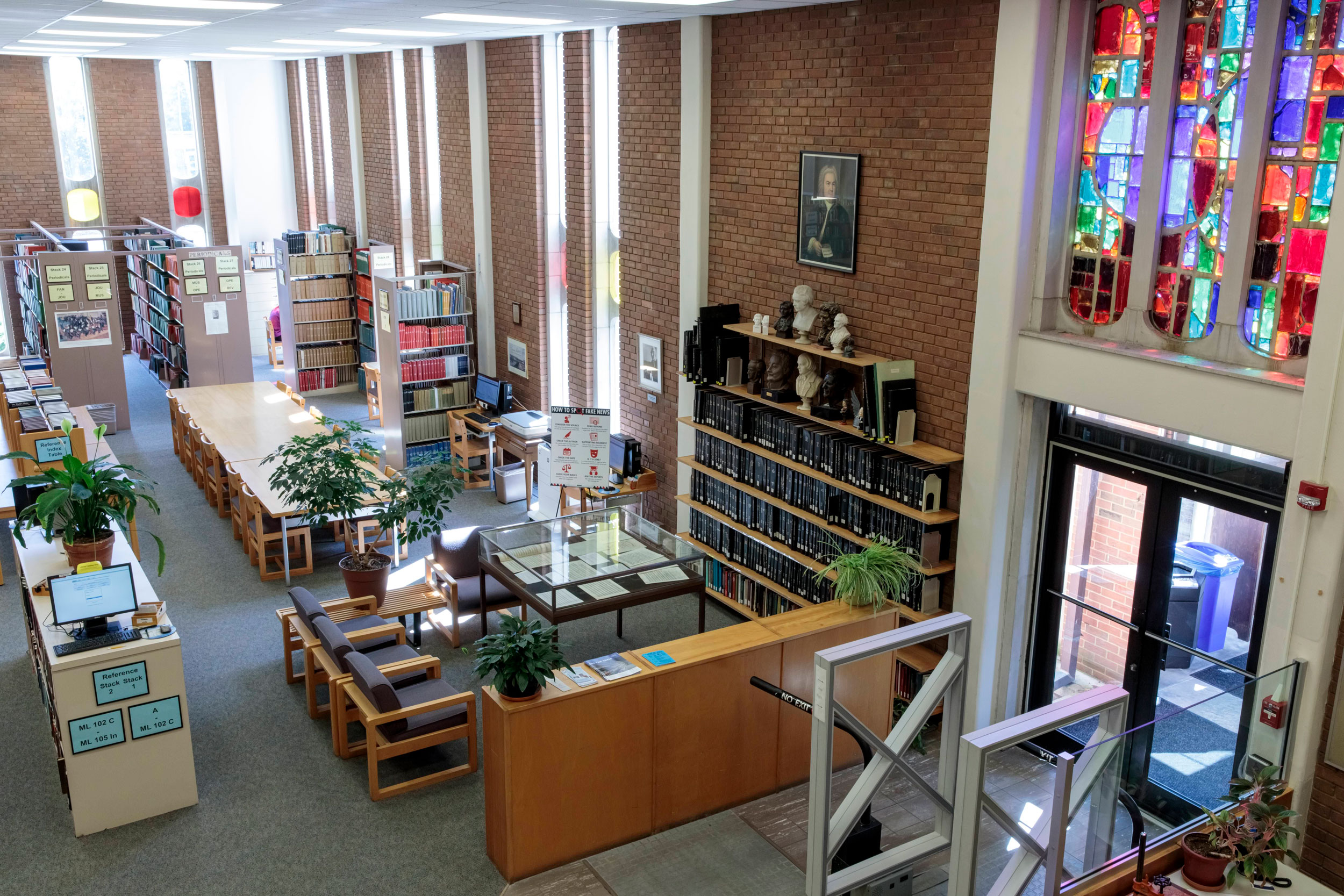 Interior shot of the Gaylord Music Library featuring the stained glass windows above an entrance.