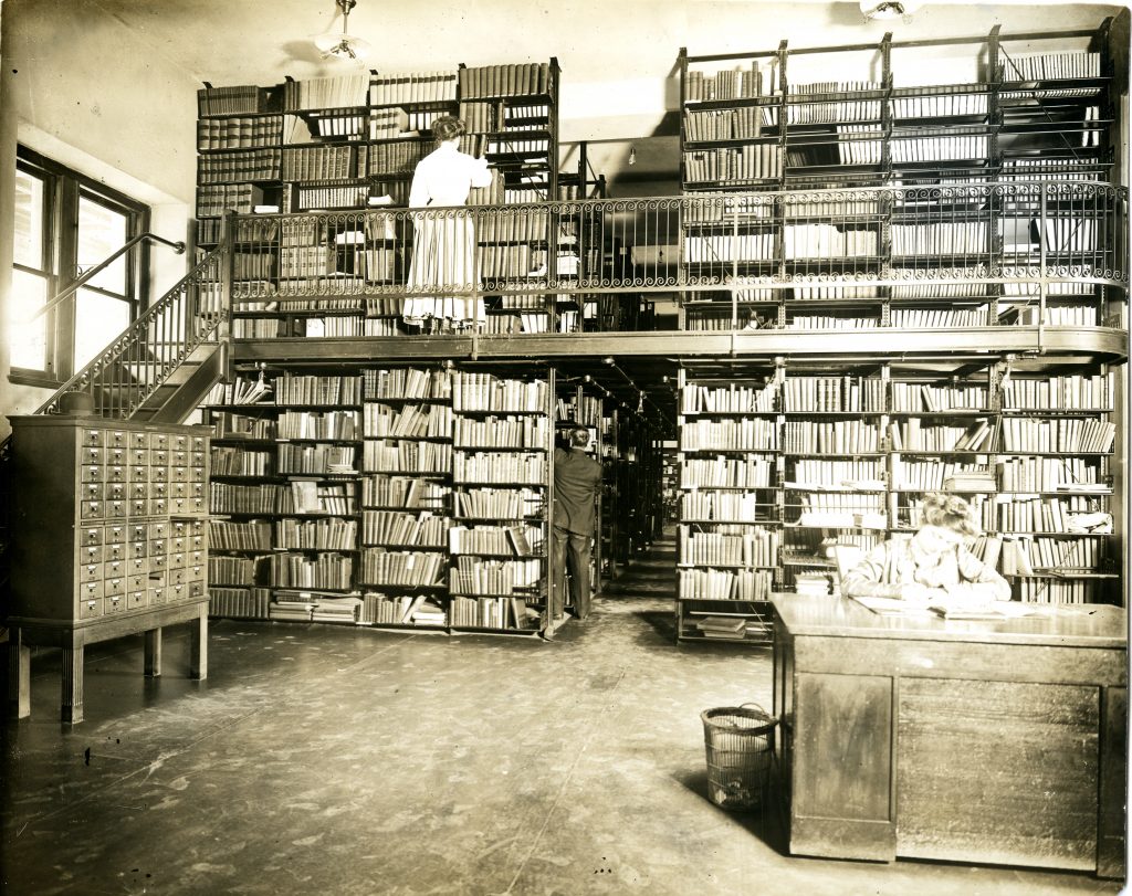 Black and white photo of book stacks in the original library at Washington University circa the late 1940s.