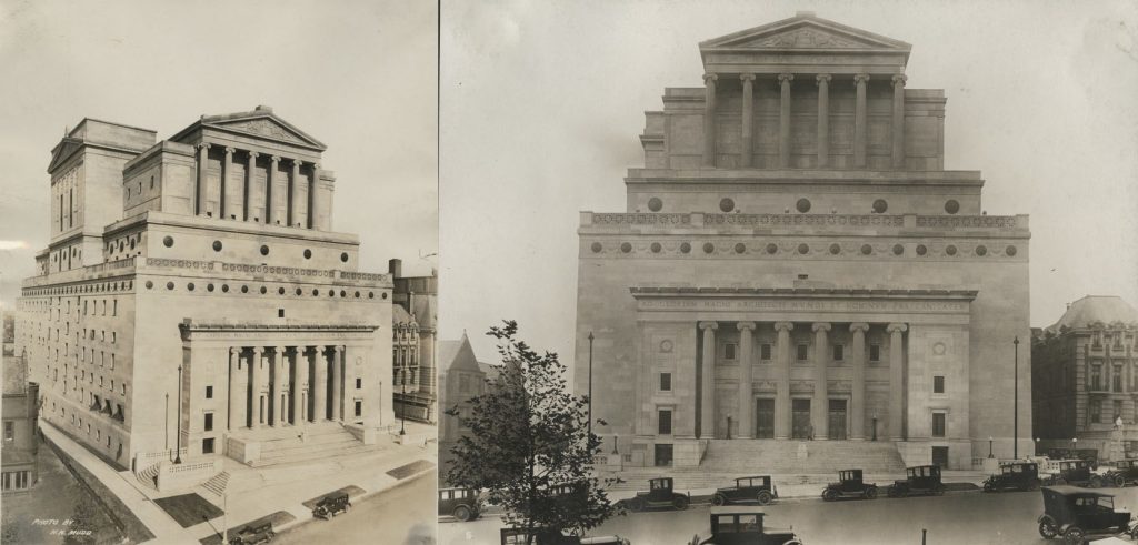 A massive, beautifully constructed Masonic Temple featuring small windows and pillars on its exterior. 