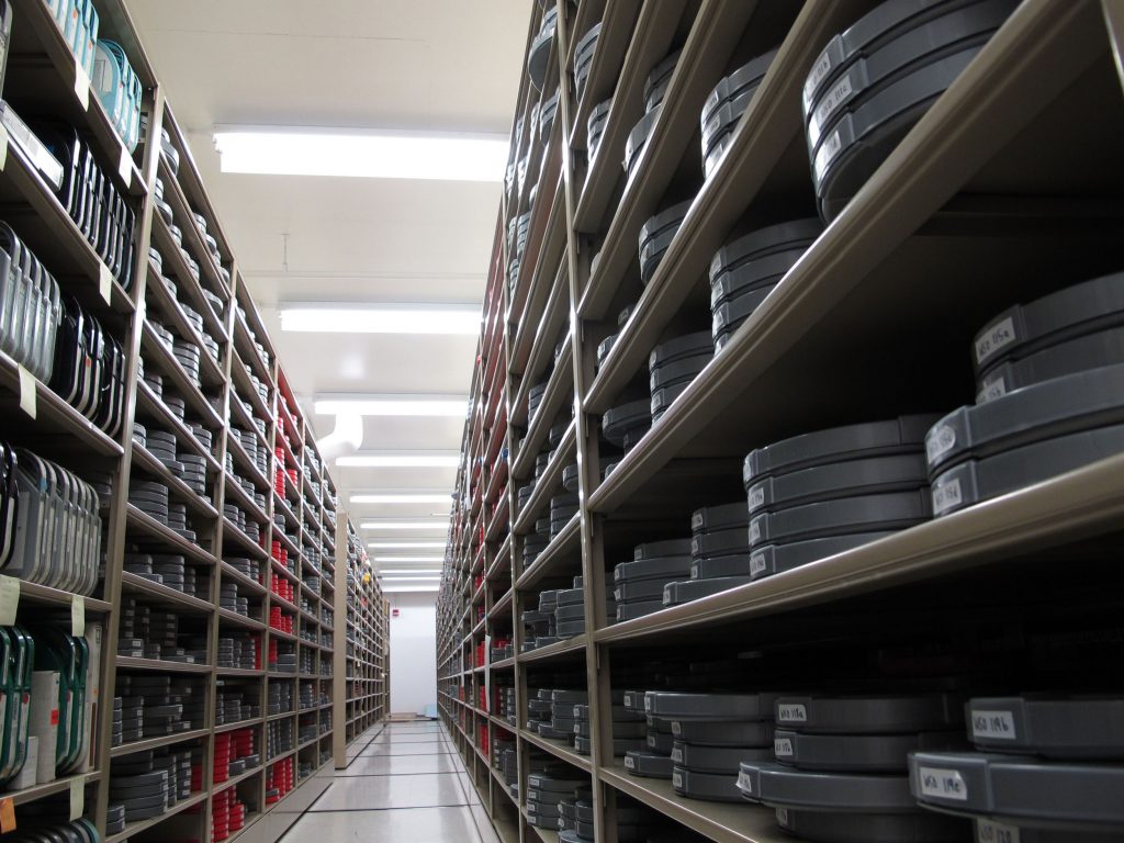 Stacks of film reels in storage at the Film and Media Archives at WashU Libraries.