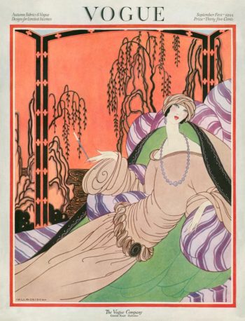 Vogue magazine cover with an illustration of a woman on a chaise lounge.