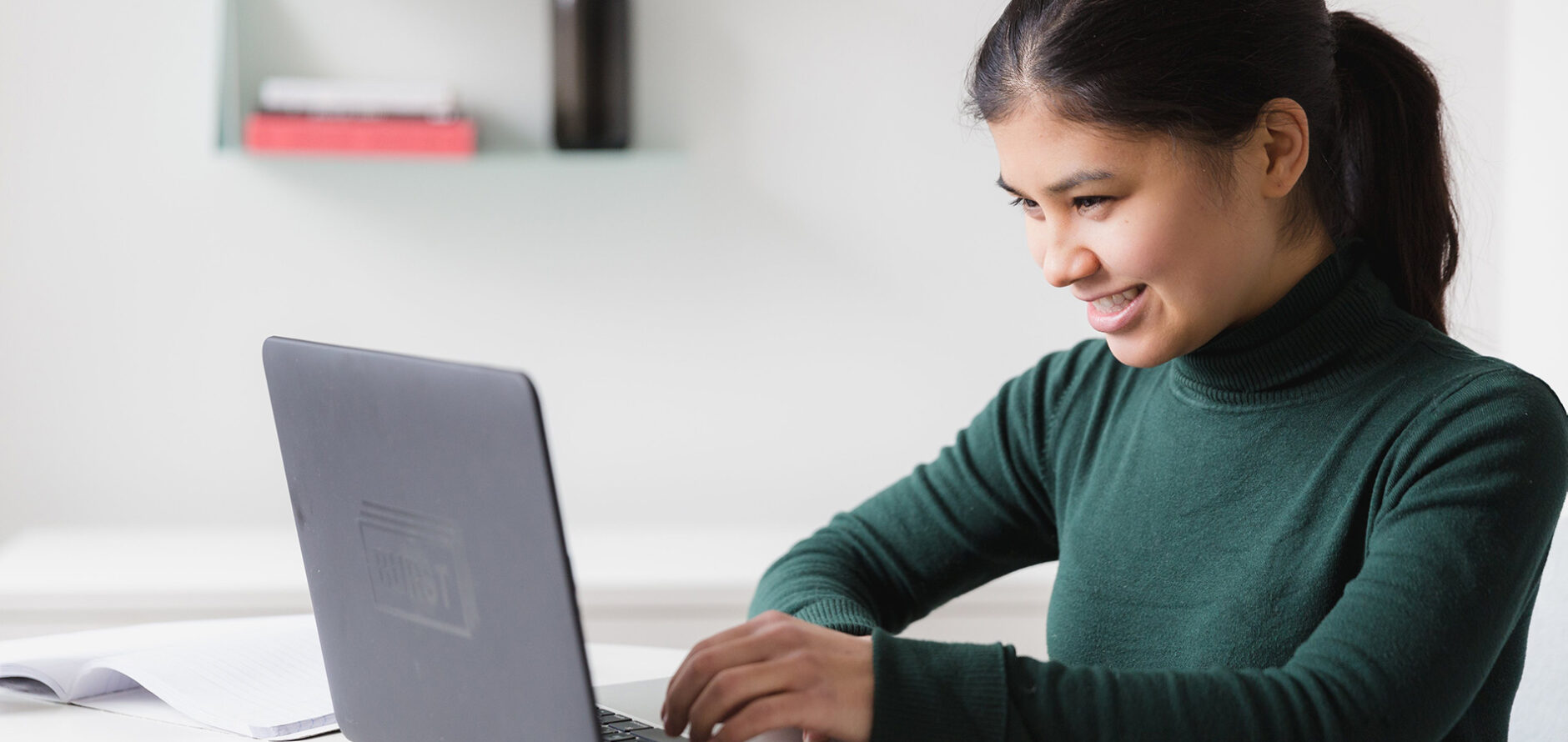 A student at a laptop.