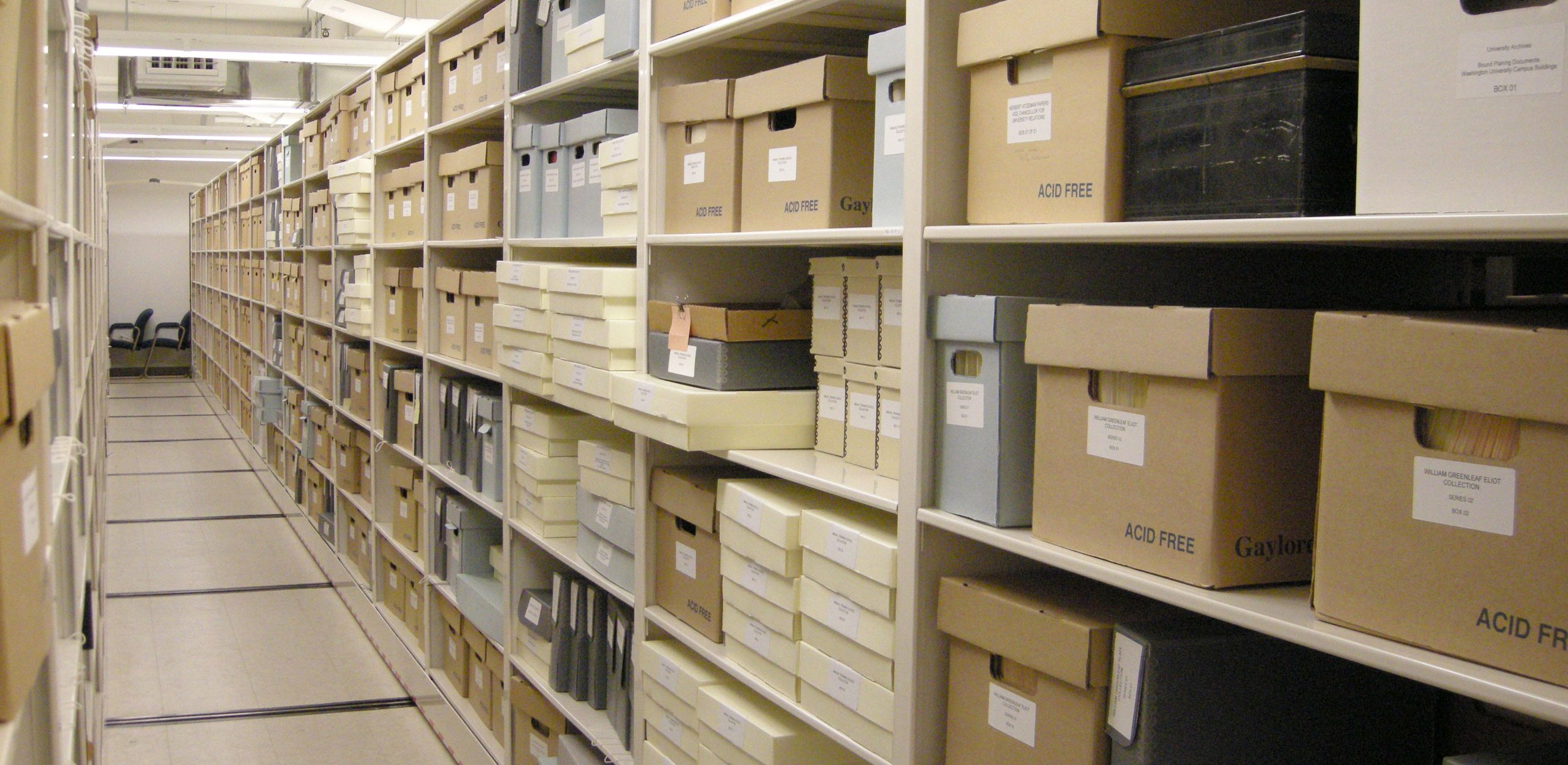 Rows of materials in boxes on the shelves of Special Collections.