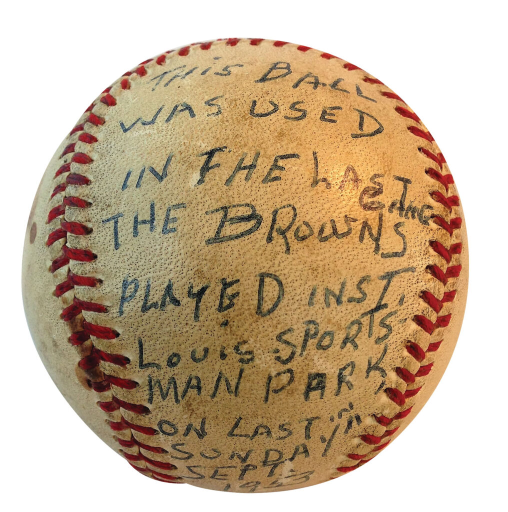 A baseball with text written in pen with all-capital letters. The writing reads: "This ball was used in the last game the Browns played in St. Louis Sportsman Park on last Sunday, Sept. 1953."