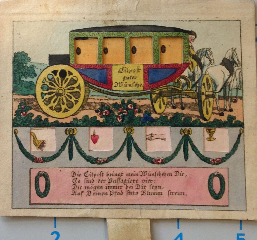 The carriage is a richly decorated one with intricately detailed wheels pulled by two white horses. The windows in this photo are closed.