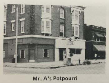 Nondescript three-story building on a city street corner in the Central West End. 