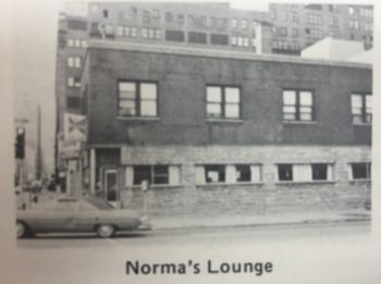 Nondescript brick building, about two-stories, with small windows along the ground floor. The building has since been demolished. 