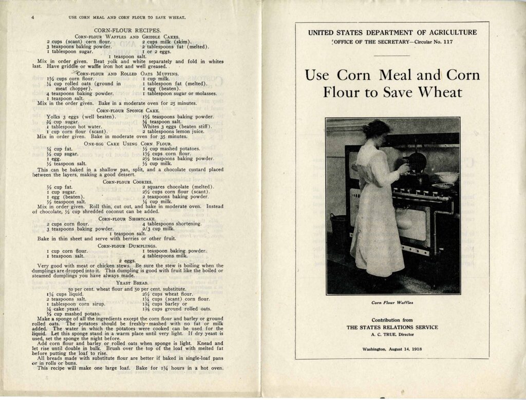 The pamphlet is titled "Use Corn Meal and Corn Flour to Save Wheat" and features a photo of a woman at a gas stove with recipes along the left.