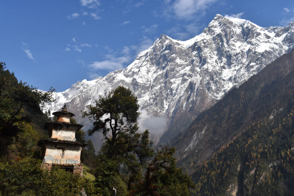 An old temple sits secluded in the midst of mountains.