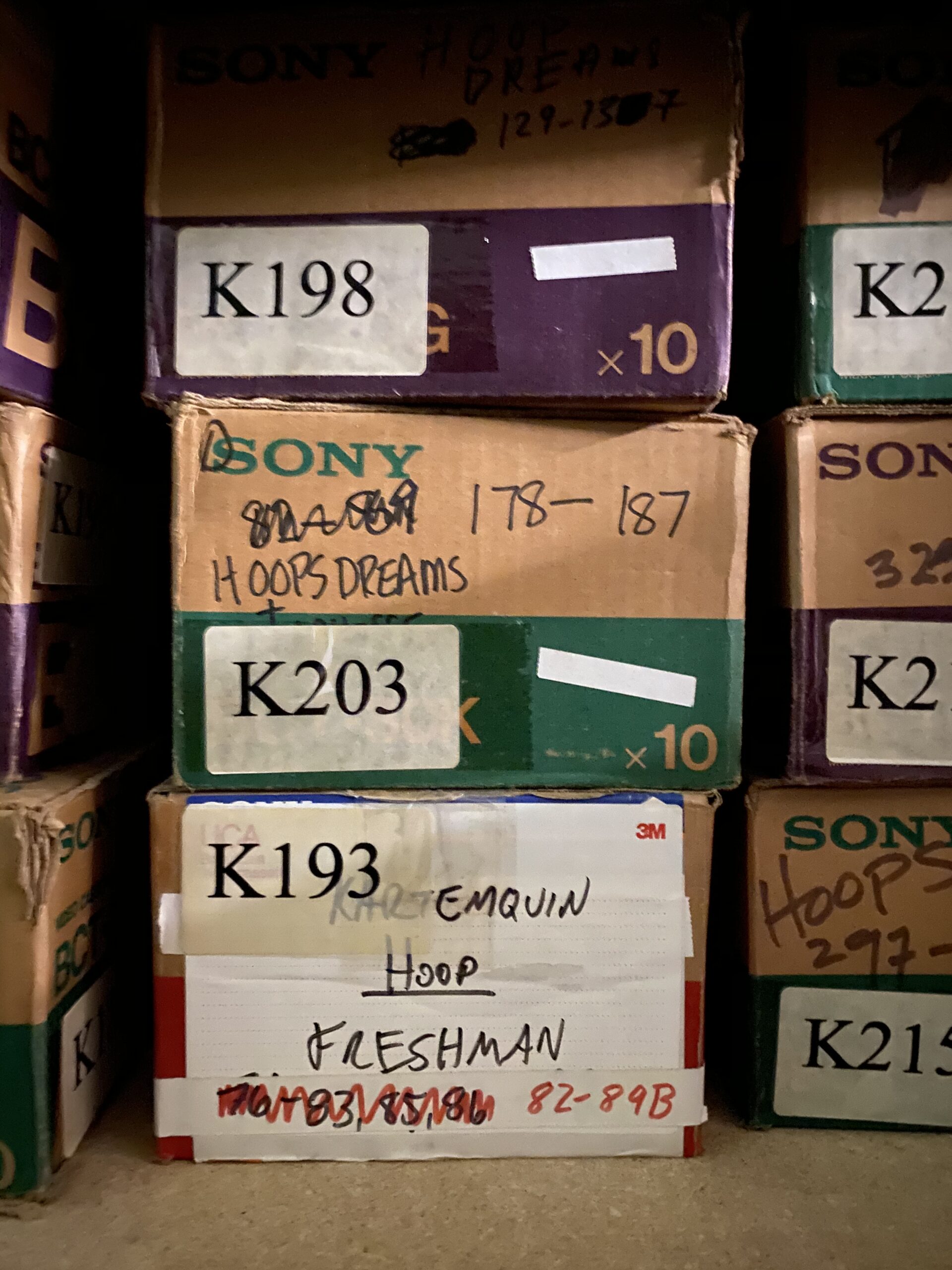 Small boxes of Sony reel film from the Kartemquin Collection, most with labels reading "Hoops" or "Hoops Dreams."