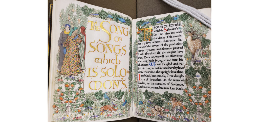 The first page of Song of Solomon with an intricately colored forest scene.