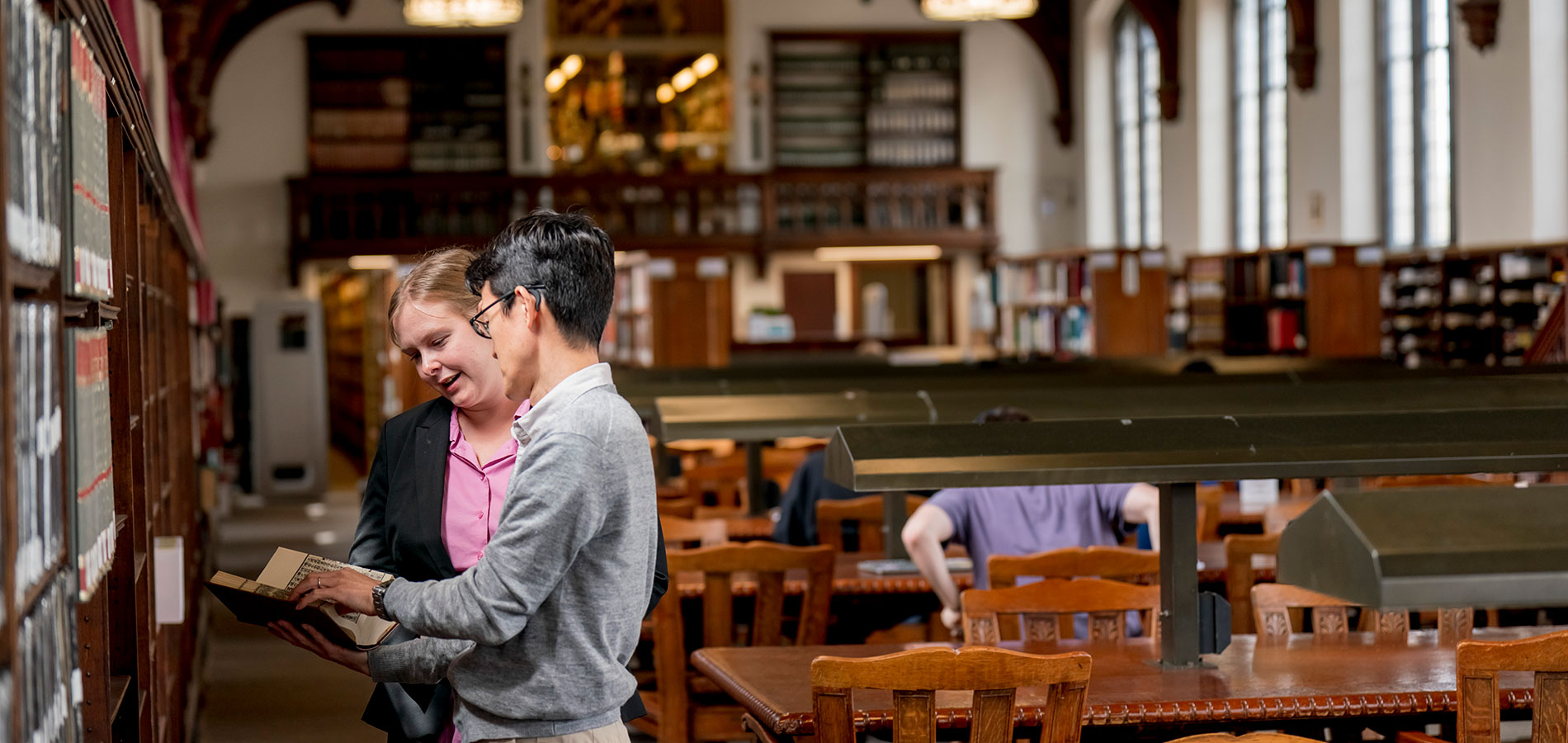 A Subject Librarian assisting a researcher in the Easat Asian Library.