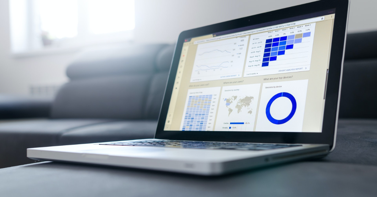 An open laptop displaying different statistical graphs.