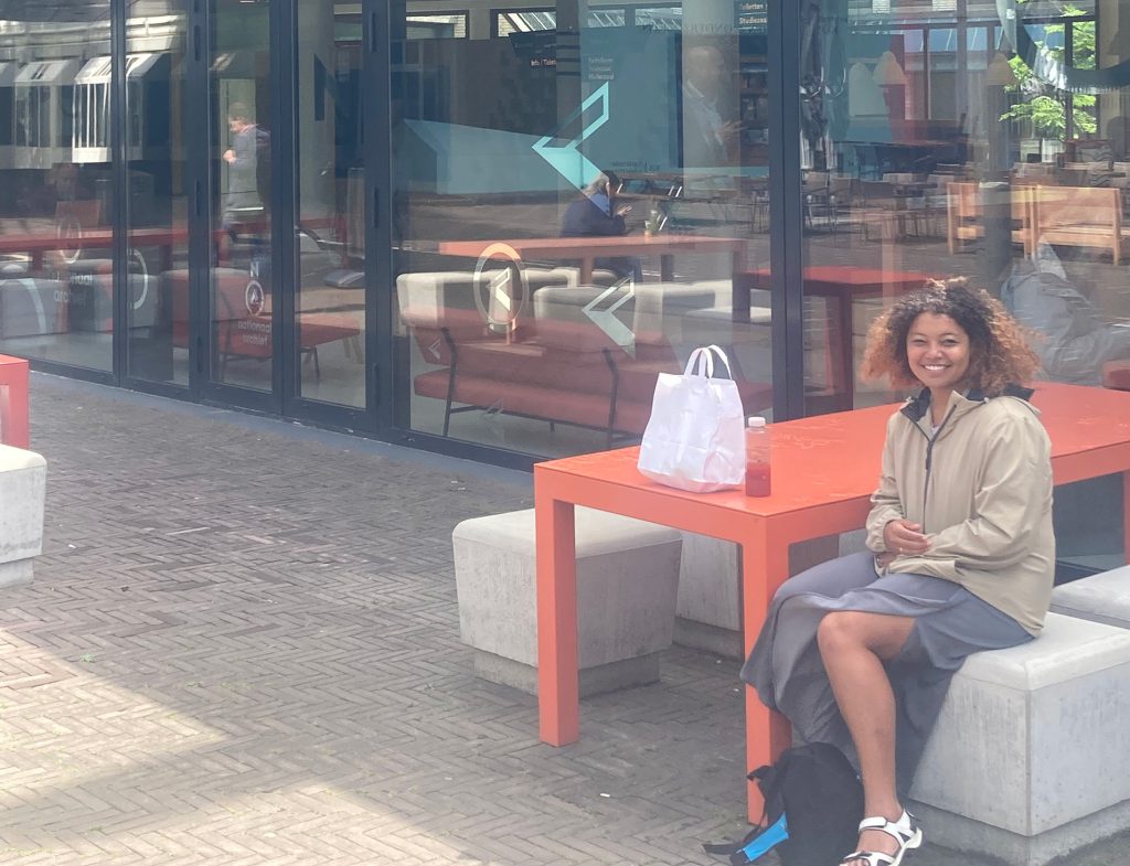 Person sitting outside the National Archives