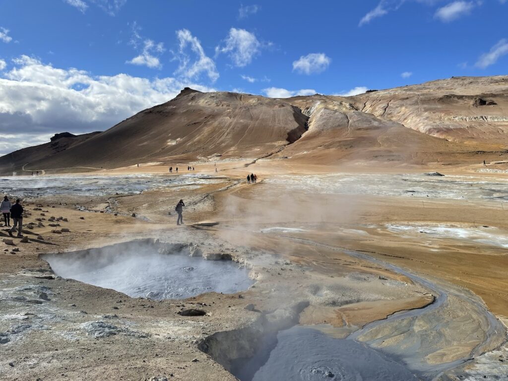 Hot springs with hills behind.