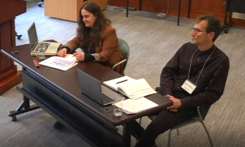 Two persons sitting at a table