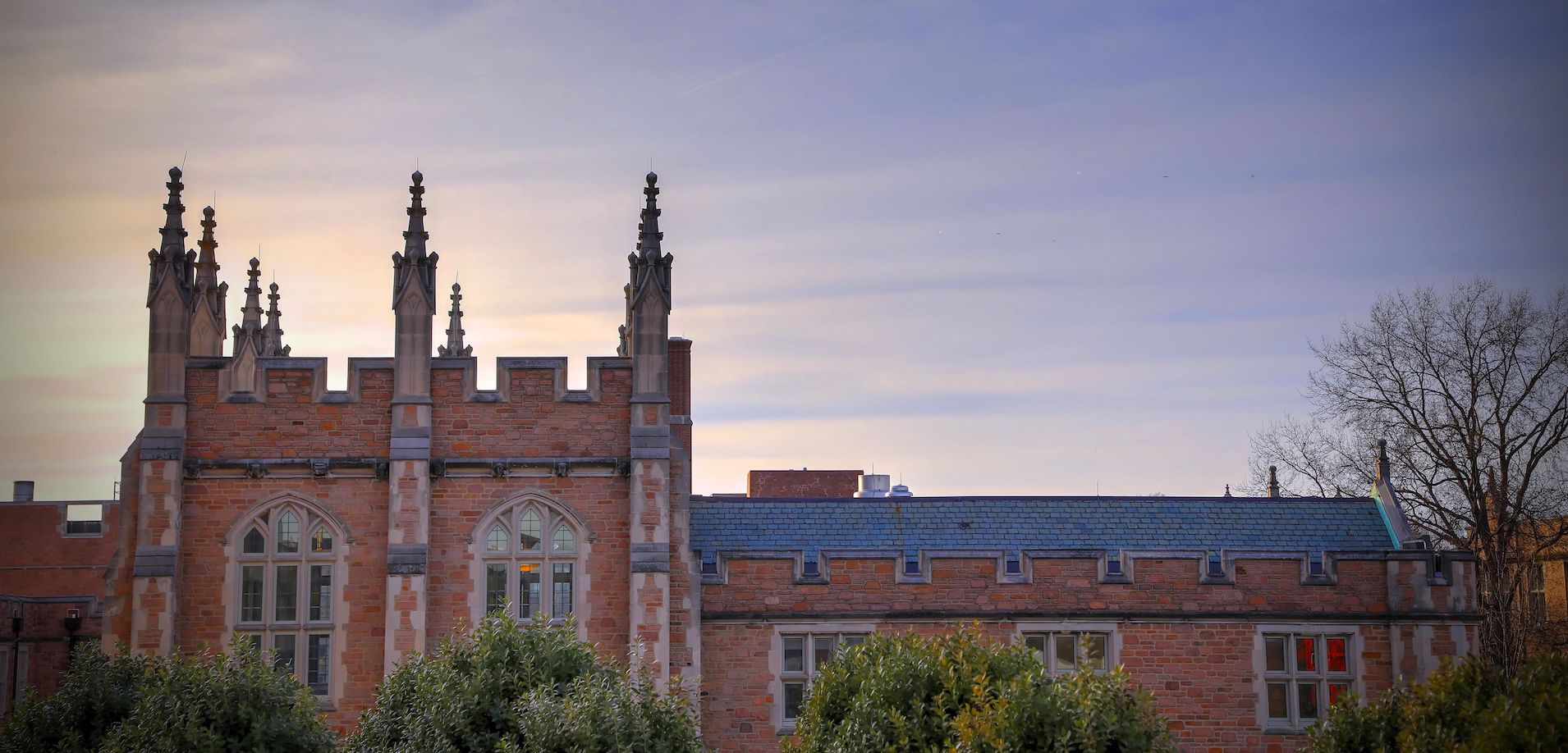 The towers of the Warren Brown Hall on the Danforth Campus against a clear sky.