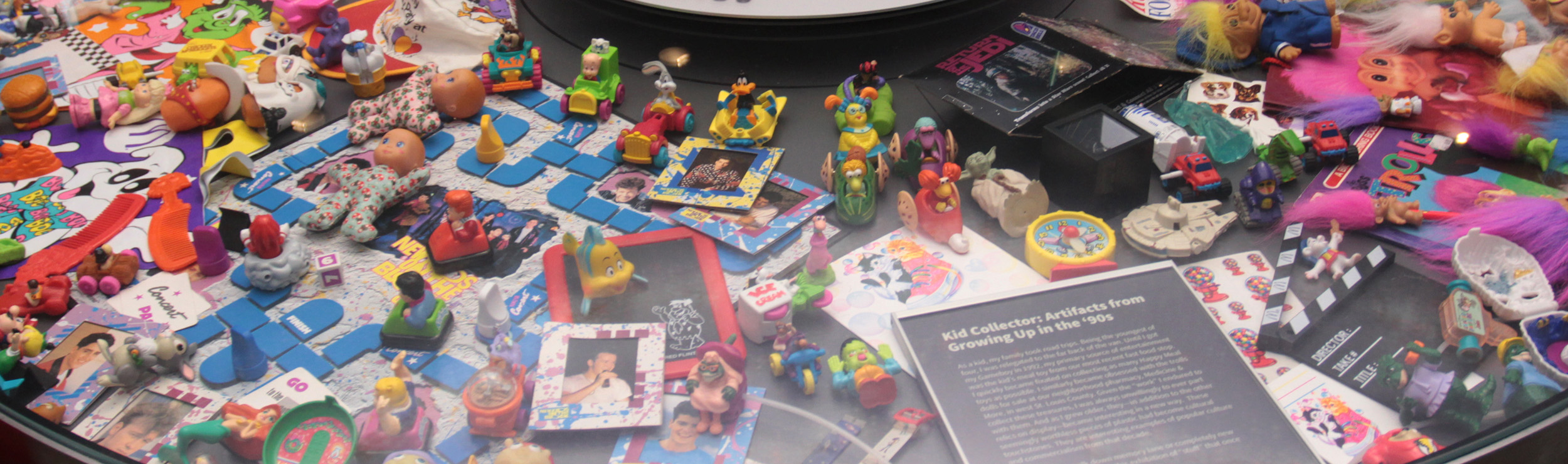 A close-up of the Collect-O-Rama display case showcasing the Kid Collector Exhibition.