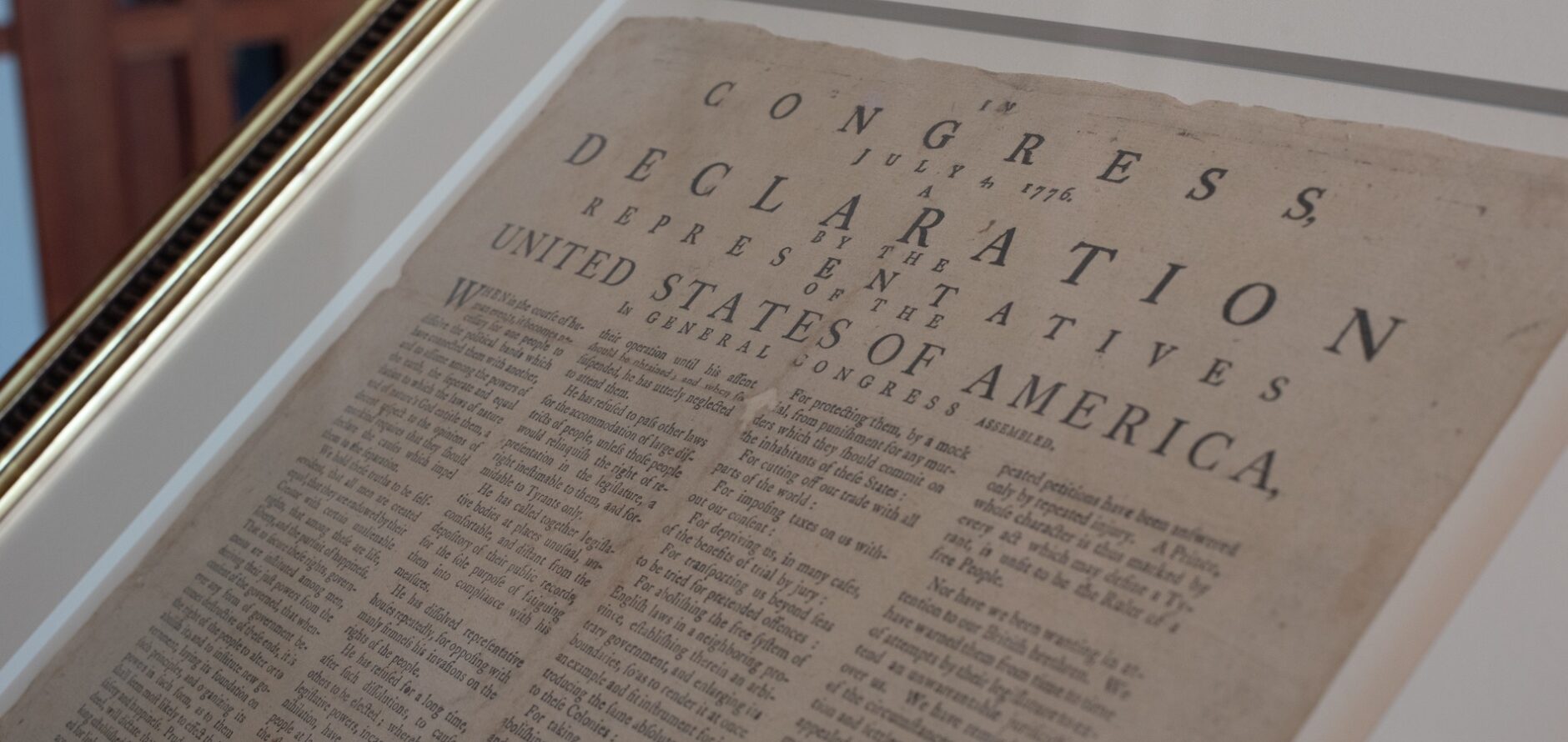 An original copy of the Declaration of Independence inside a glass frame