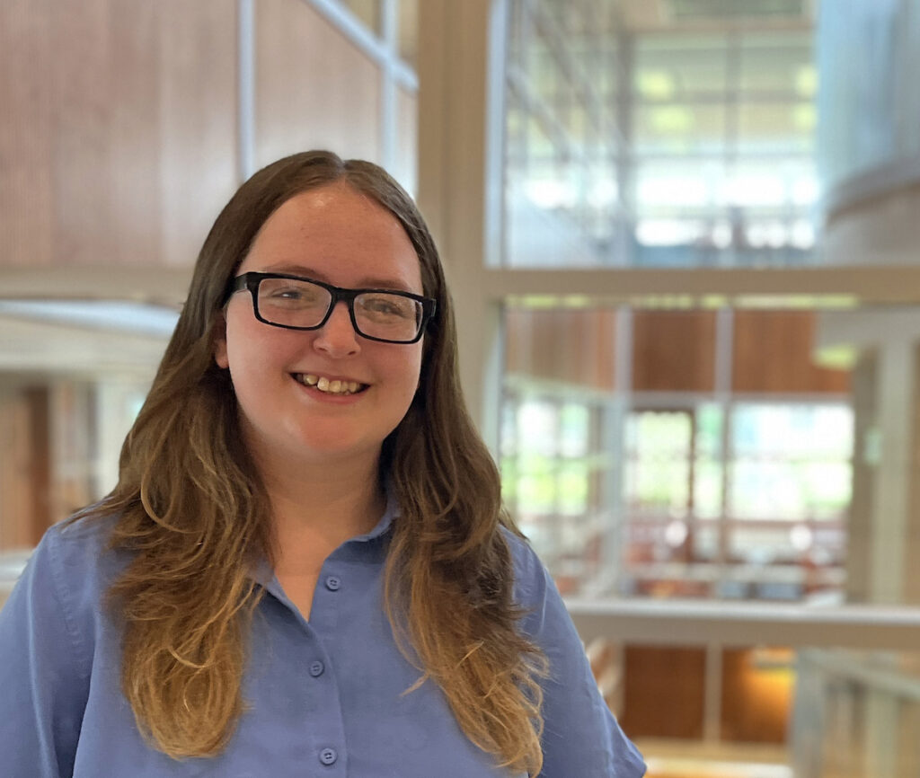 Woman in a Blue shirt and glasses