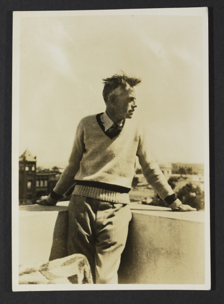 Man leaning against a parapet walll