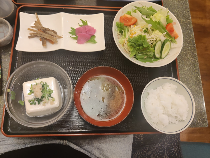 Food arranged in bowls on a tray