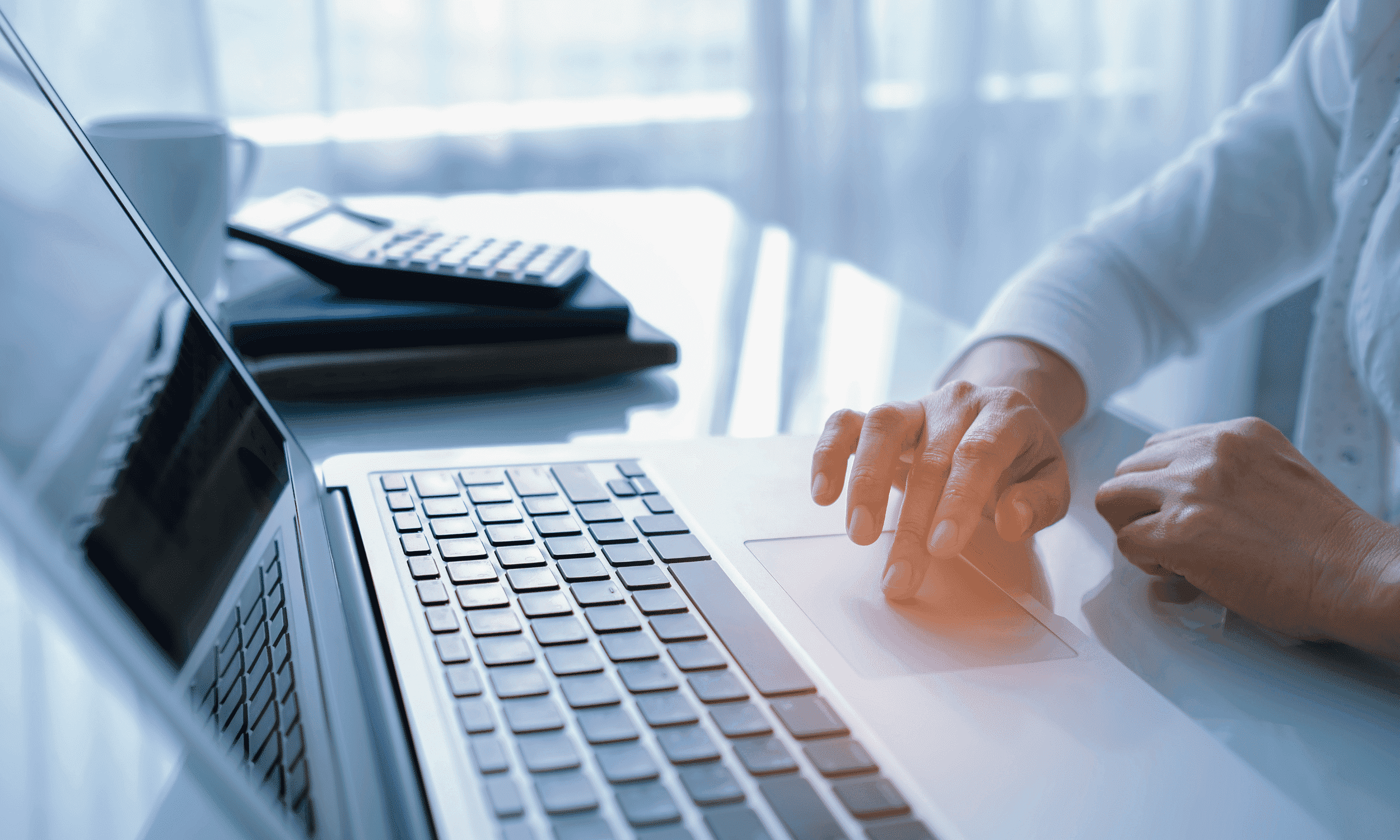 Stock photo of person using laptop computer