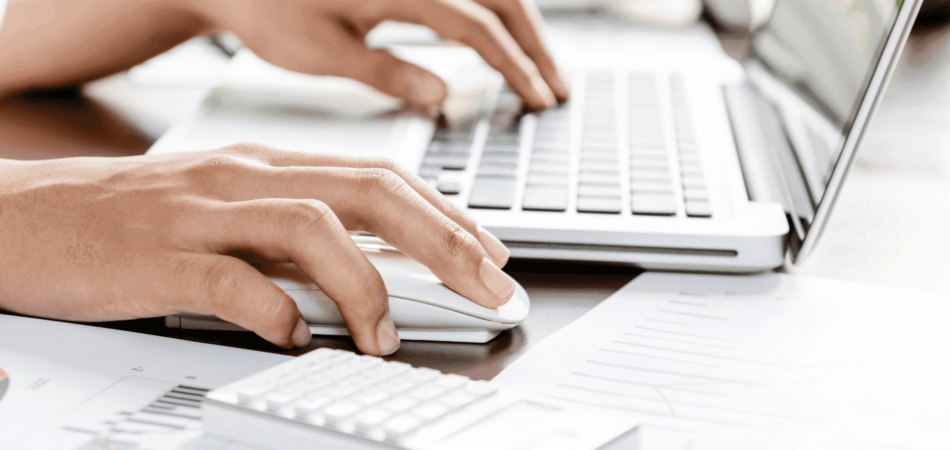 Person using a mouse on a laptop computer