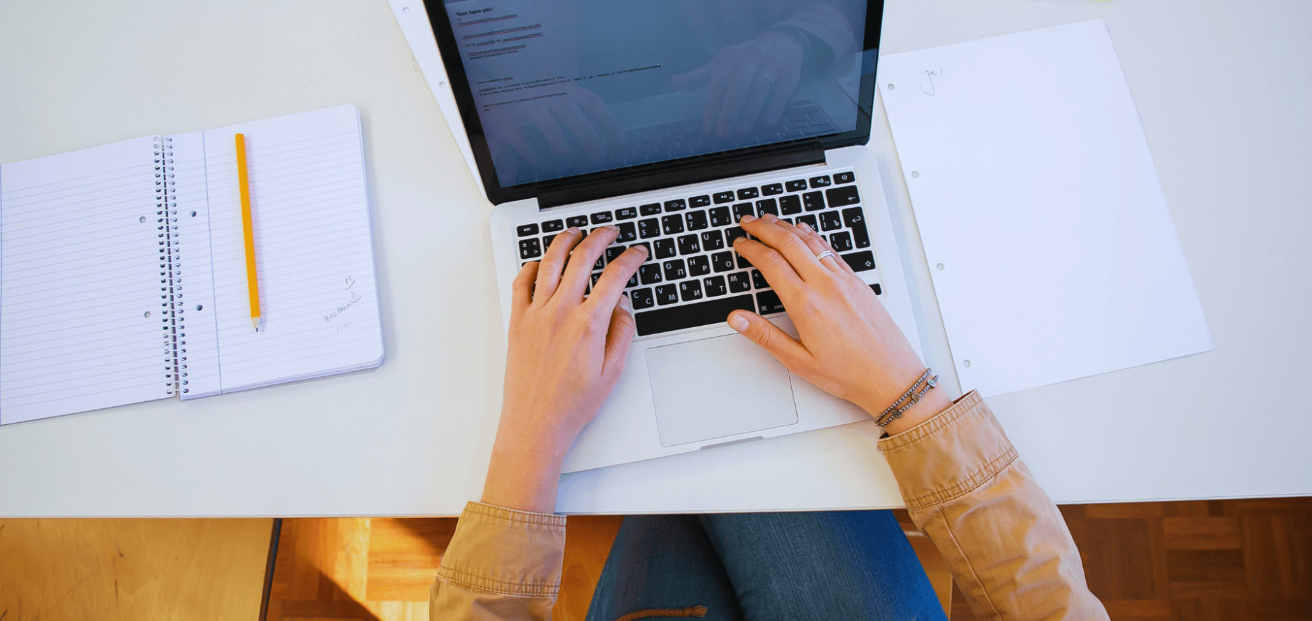 Stock photo of hands typing on laptop computer