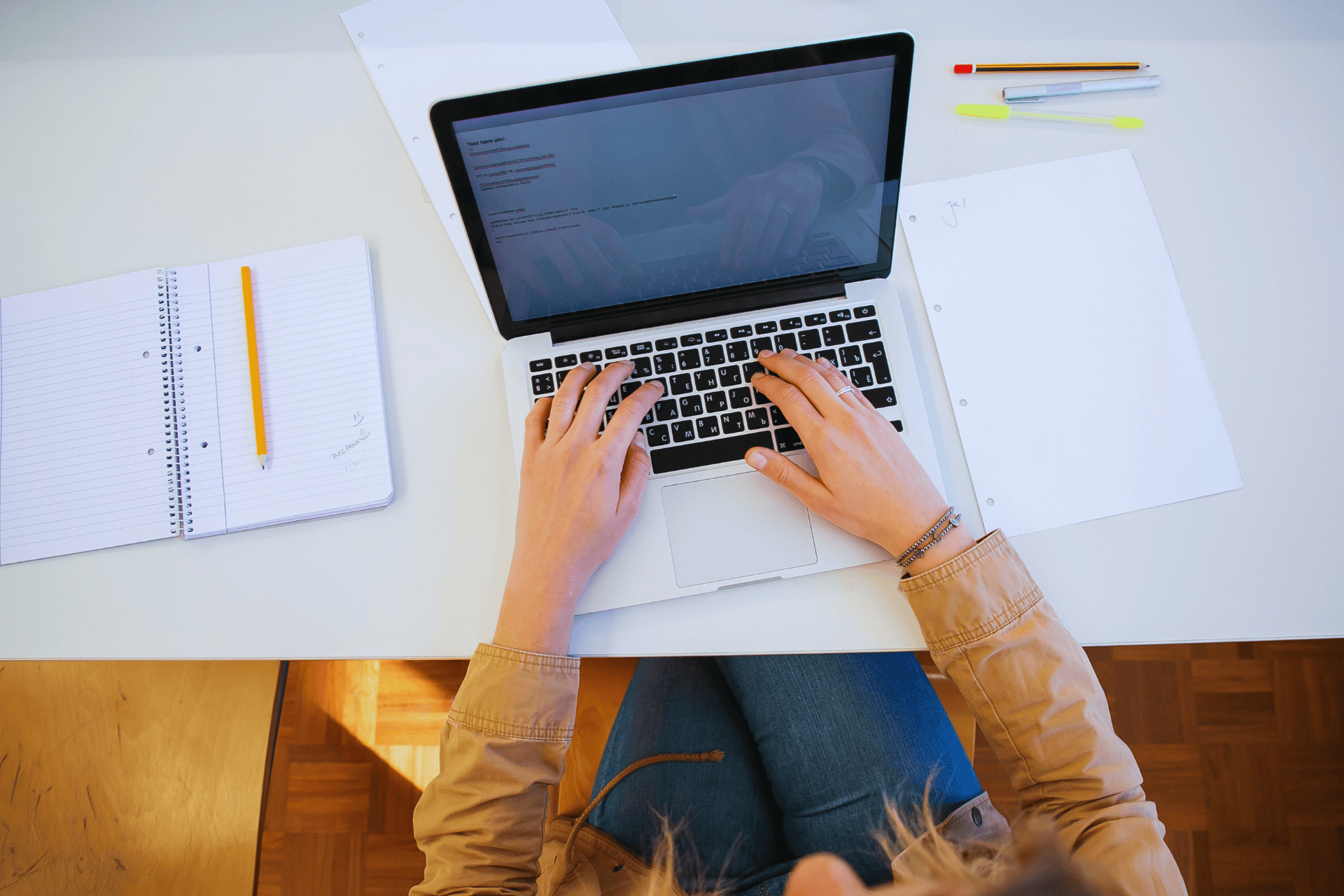 Stock photo of hands typing on laptop computer