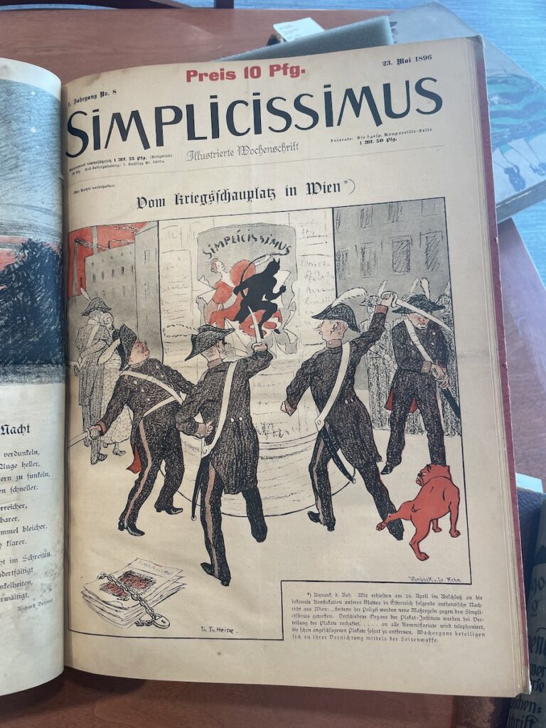 Cover of Simplicissimus featuring men in uniform with a bulldog attacking a poster.