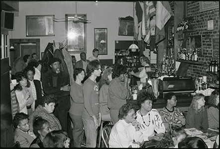 A packed bar of people attending an event.