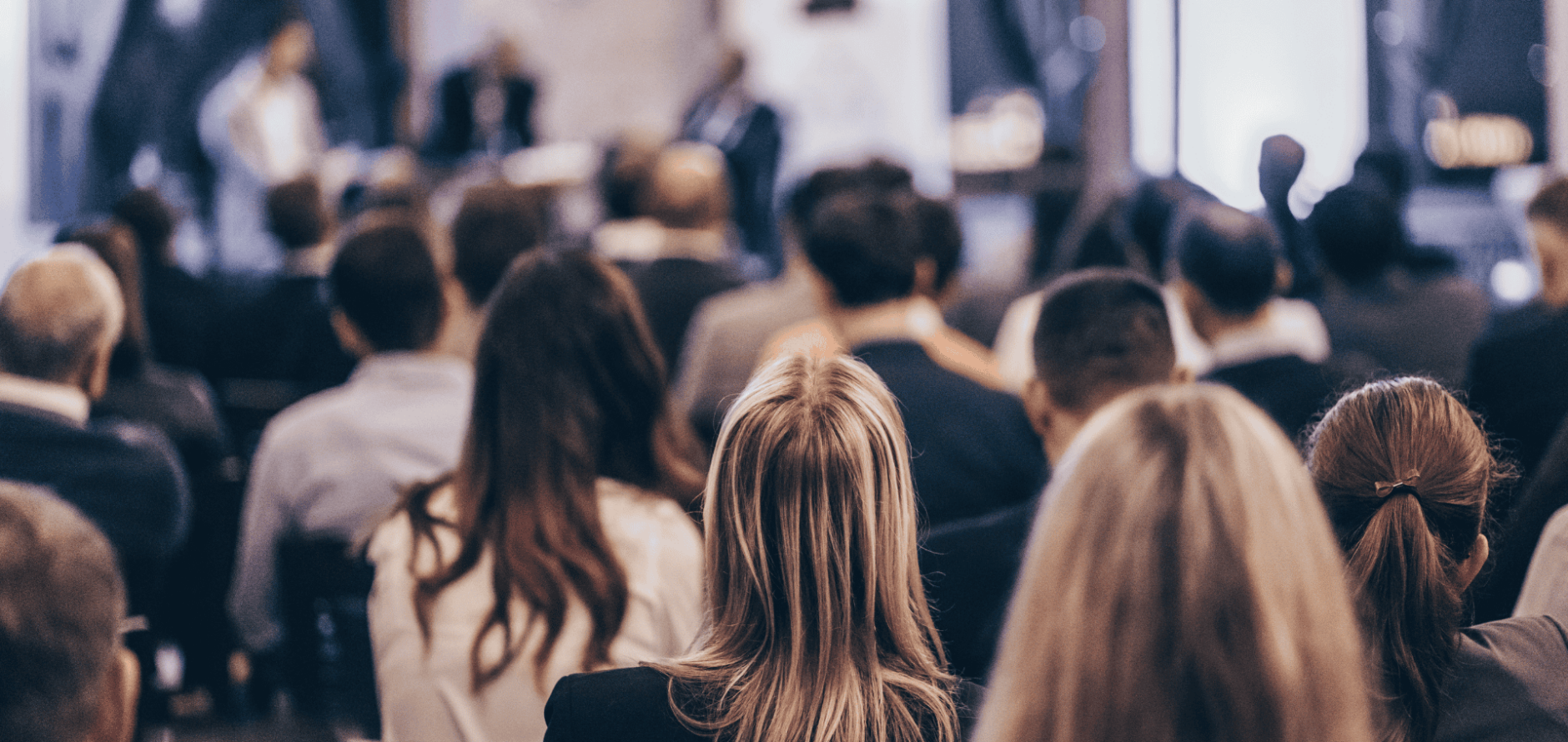 Stock photo of audience listening to a lecture