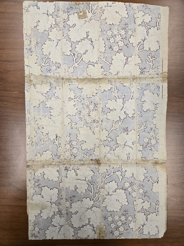 Old blue paper with white flowers