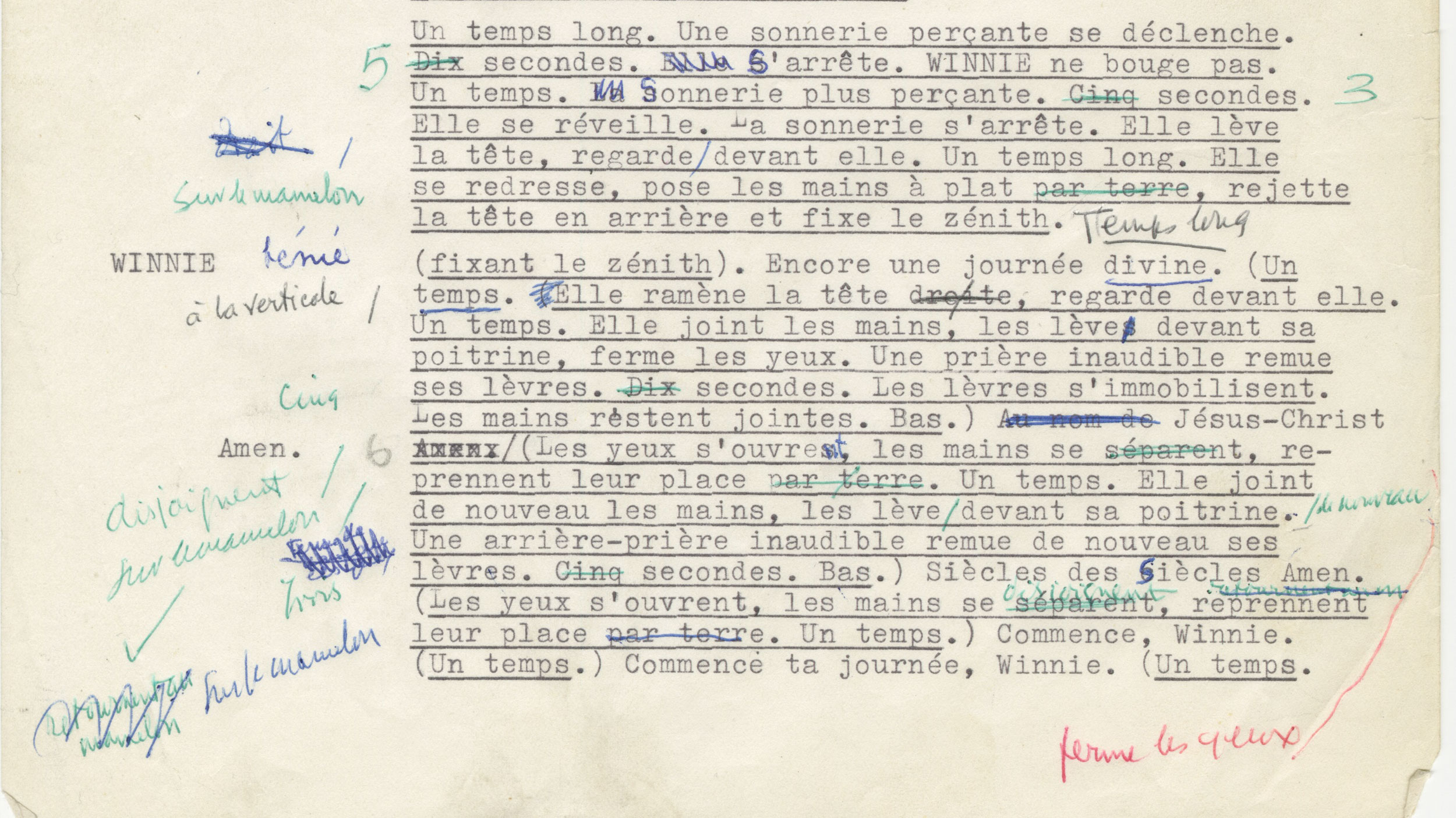 A typewritten draft of a play script written in French with handwritten annotations in blue, green, and red pen.