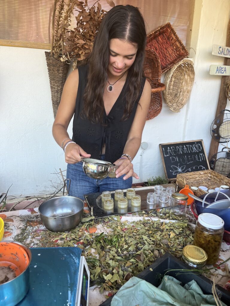 Person pouring liquid into a bottle