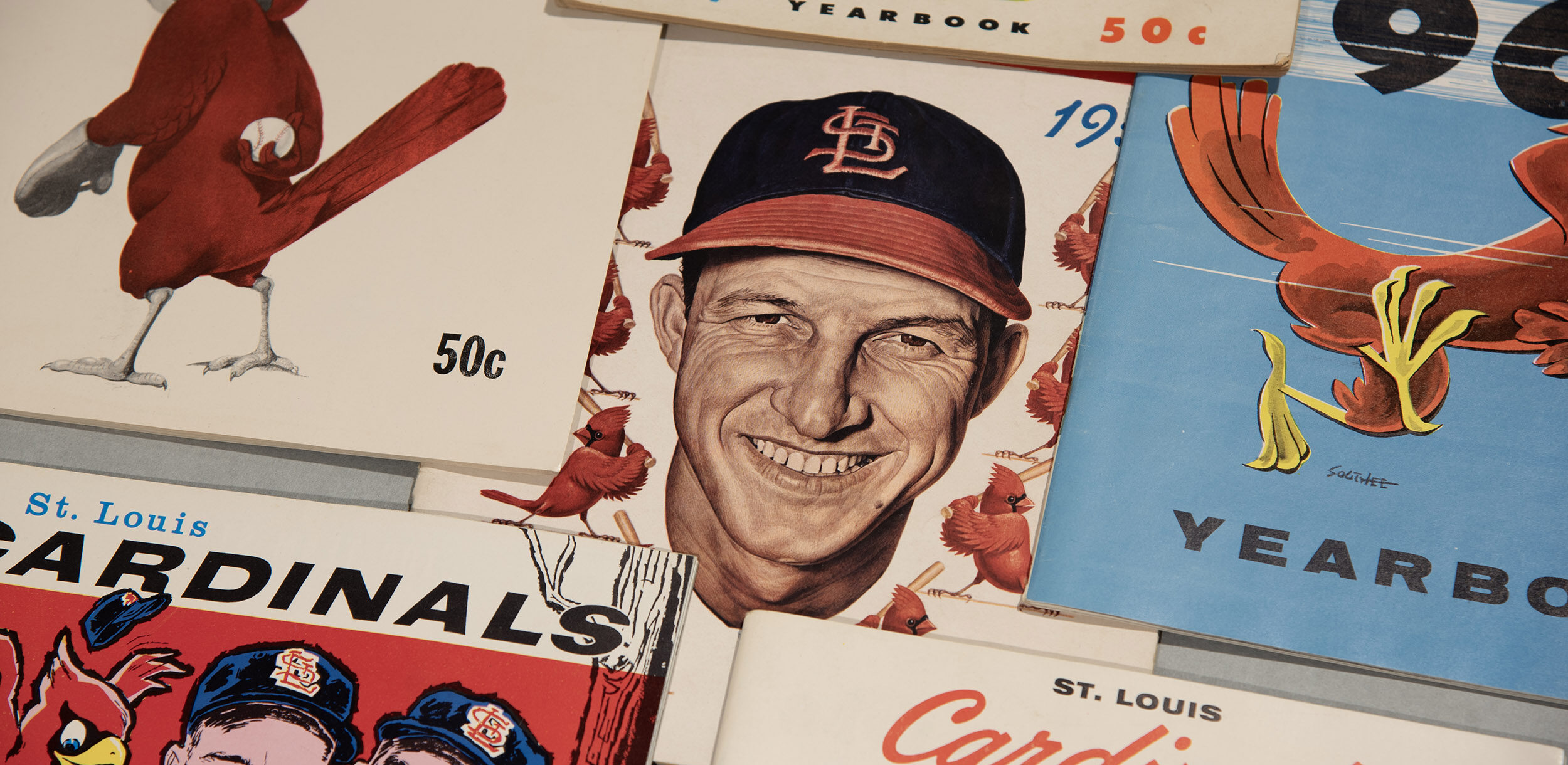 Collage of St. Louis Cardinals baseball paraphernalia.
