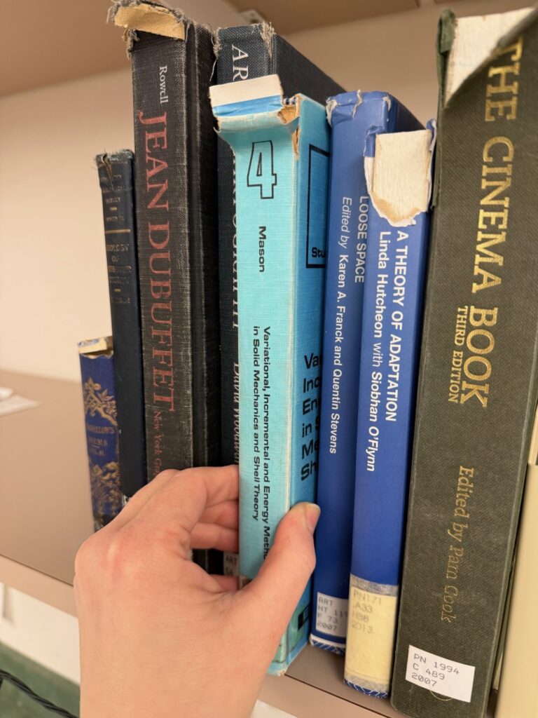 A row of books with damaged spines