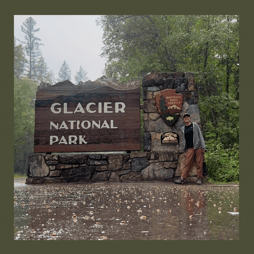 Person standing in front of a sign