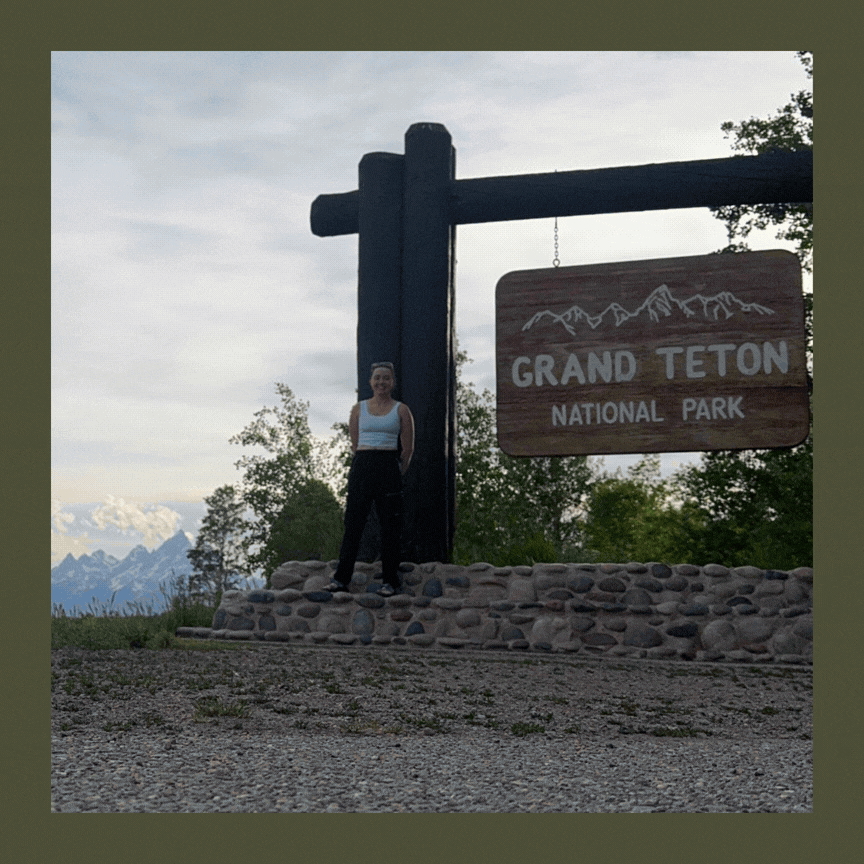 Woman standing in front of a sign