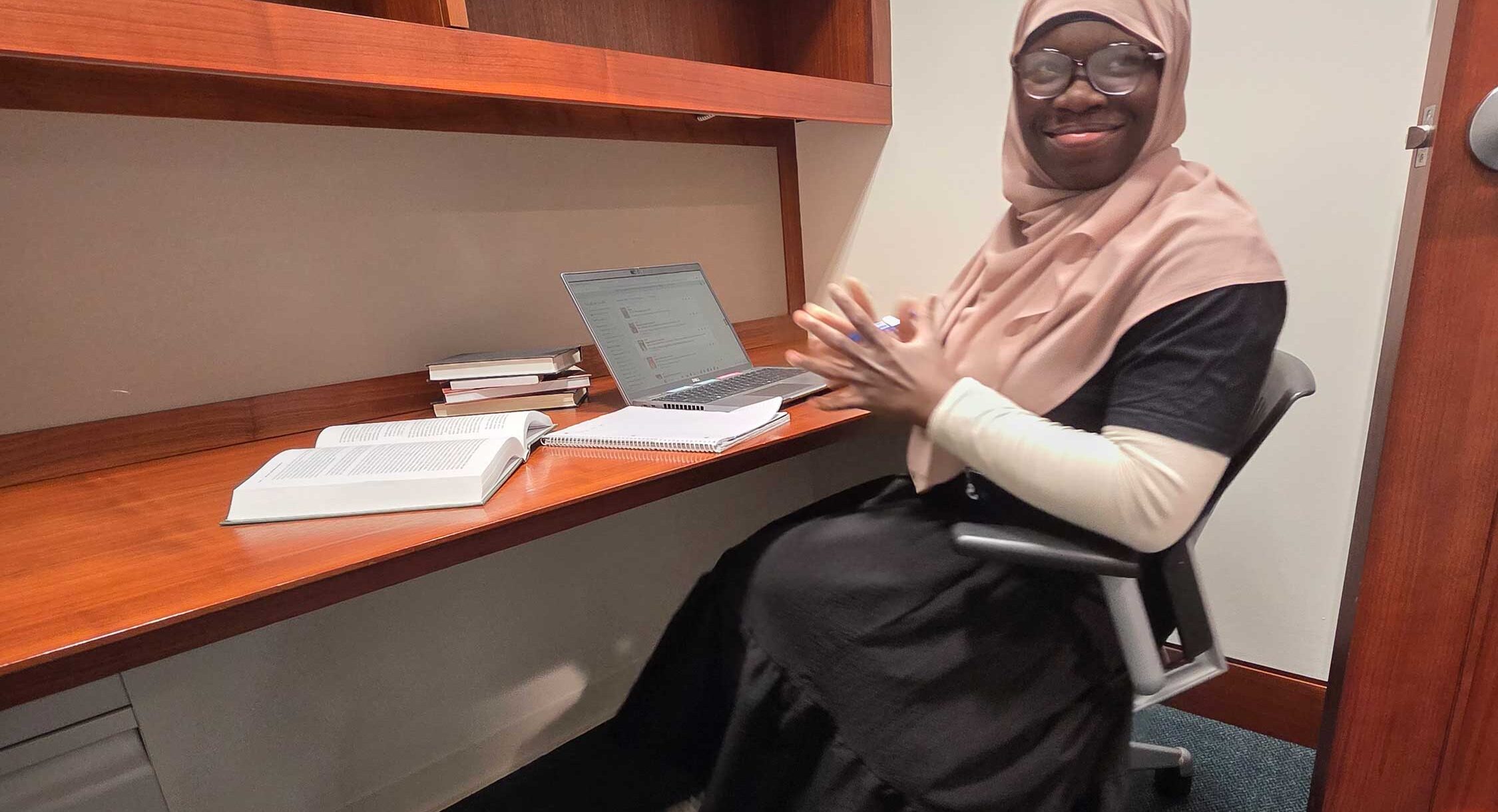 student sitting in a private carrel in Olin Library