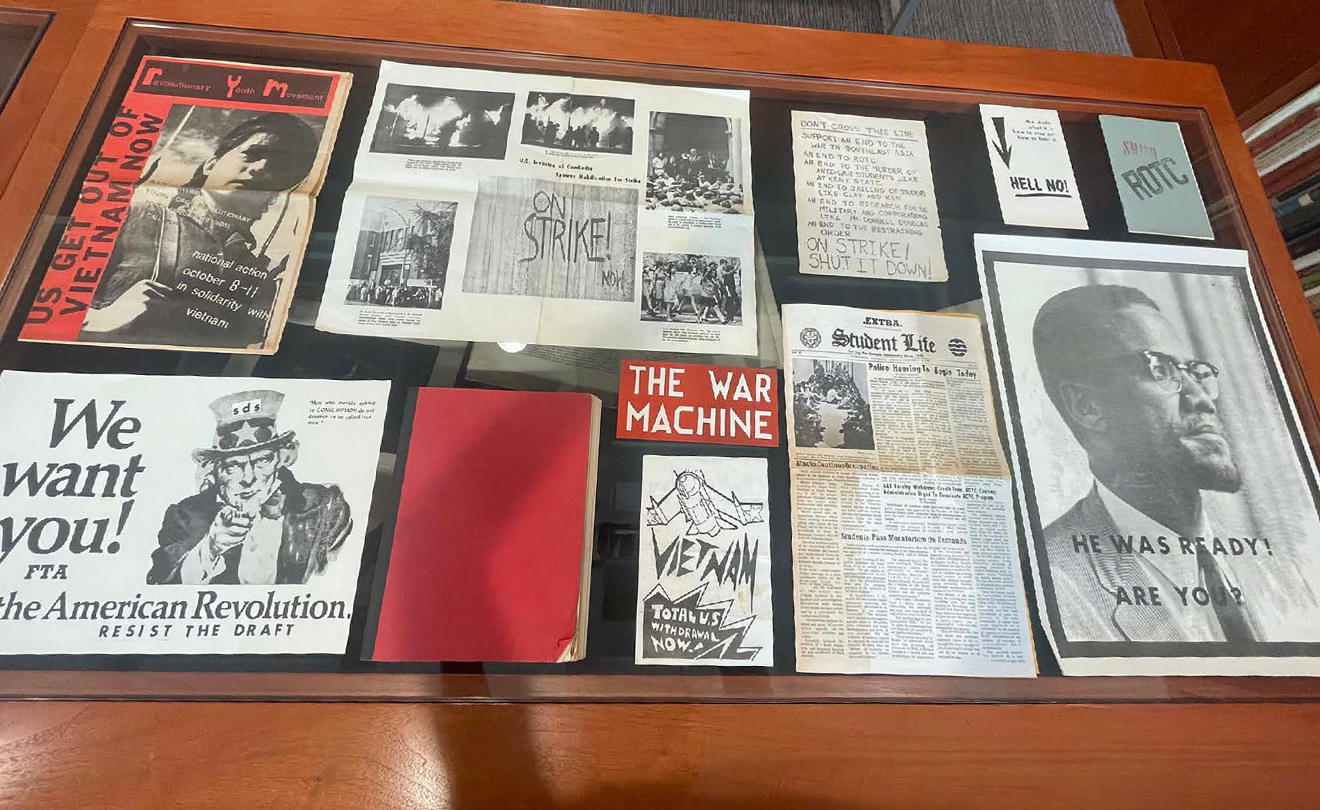 A collage of student protest flyers and materials.