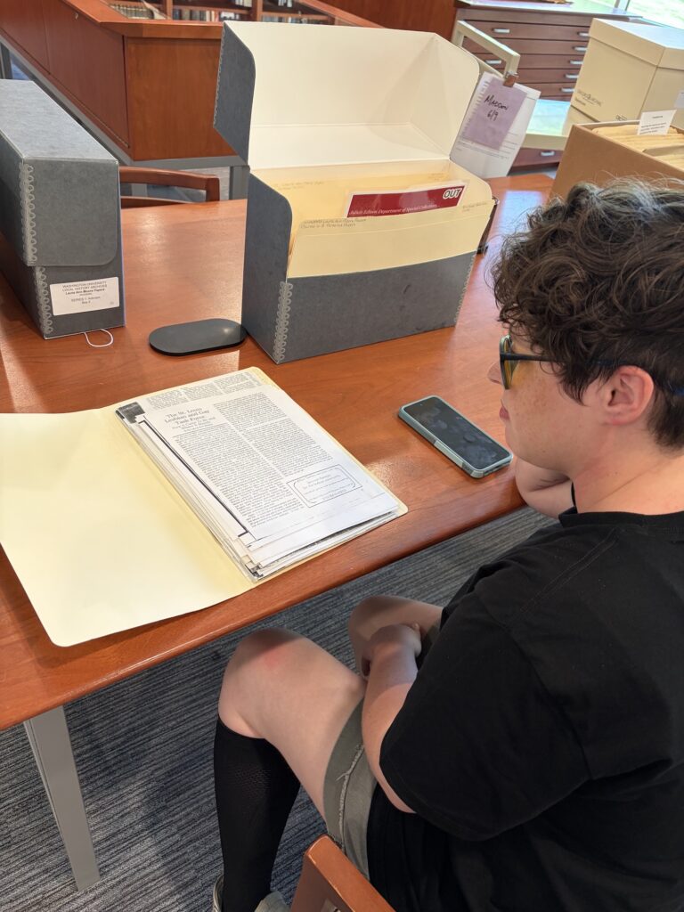 Layne Madden with local history collection materials