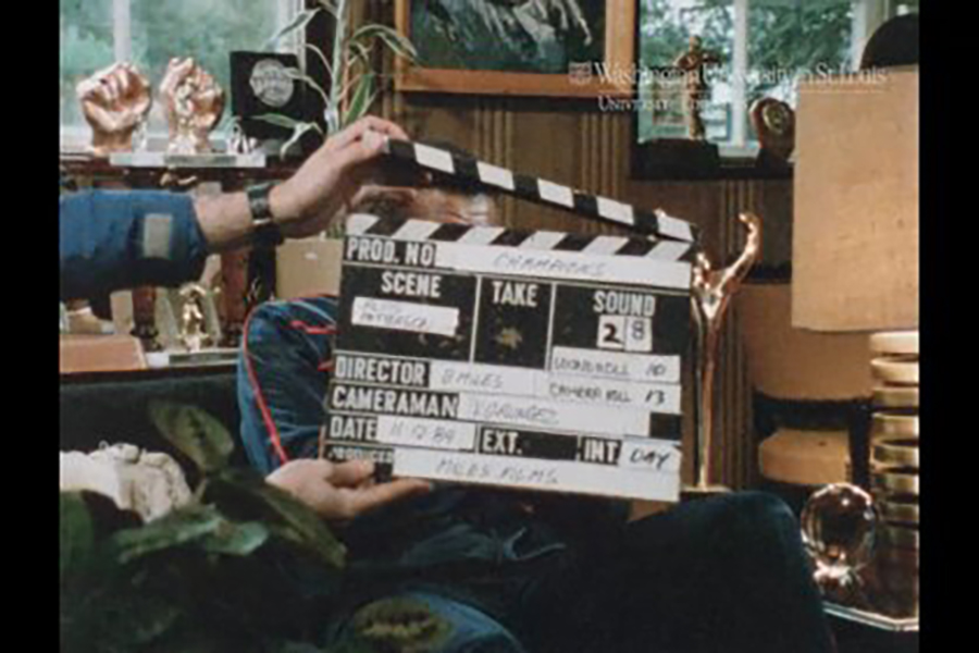 William Miles Black Champions film marker clapper in front of an interview subject.